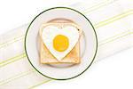 Fried egg sunnyside in heart shape on plate, top view. I love breakfast. Fresh modern image language. Culinary arts.