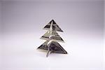 Christmas tree origami made of banknotes dollar. Handmade