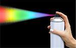 The color of the dispersion jet from an aerosol can in feminine hand on dark background