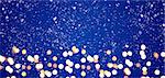 Blue festive Christmas or New Year background with shiny golden baubles