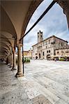 The old arcades frame the historical buildings of Piazza del Popolo, Ascoli Piceno, Marche, Italy, Europe