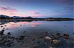 Pink clouds at sunset are reflected in the blue sea, Villasimius, Province of Cagliari, Sardinia, Italy, Mediterranean, Europe