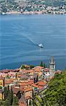 The typical village of Varenna surrounded by the blue water of Lake Como and gardens, Province of Lecco, Italian Lakes, Lombardy, Italy, Europe