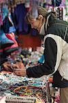 Shopping for souvenirs in Namche Bazaar, the main town during the Everest base camp trek, Khumbu Region, Nepal, Asia
