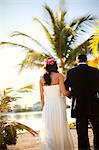 Portrait of a newlywed couple on a tropical beach.