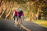 Mature woman and older man out cycling together