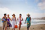 Happy mature friends enjoying a day at the beach.