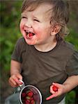 Boy eating strawberry