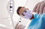 Close-up of dentist holding dental tools at dental clinic