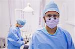 Portrait of dentist smiling at camera at dental clinic