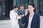 Confident businesswoman talking on mobile phone