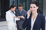 Confident businesswoman talking on mobile phone