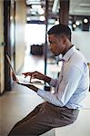 Businessman working over laptop in office