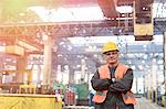 Portrait confident steel worker in factory