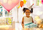 Portrait smiling girl holding birthday gift