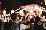 Caucasian man taking pictures at Japanese traditional Bon Odori festival