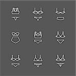 White line bra and panties icons set on black. FAshion styles illustration