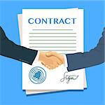 Handshake of two businessmen on the background of the contract. Signed documents.