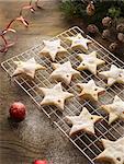 Christmas star biscuits on cooling rack