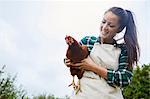 Woman holding chicken