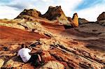 Photographer photographing White Pocket rock formation, Page, Arizona, USA