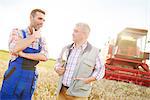 Farmers in wheat field chatting