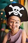 Portrait of young girl dressed up as a pirate.