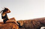 Woman relaxing and enjoying view, Horseshoe Bend, Page, Arizona, USA