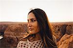 Woman looking sideways at view, Horseshoe Bend, Page, Arizona, USA