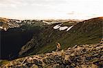 Woman on rocky outcrop, Rocky Mountain National Park, Colorado, USA