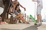 Skateboarders standing and talking, Budapest, Hungary