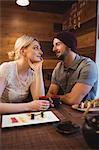 Couple having sake drink in restaurant