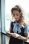 Businesswoman using mobile phone