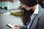 Businesswoman using mobile phone