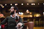 Man sitting with glass of wine