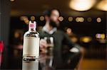 Small liquor bottle on table