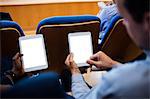 Business executives participating in a business meeting using digital tablet