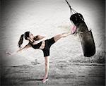 Woman is training with the punching bag. Fitboxe woman coach