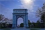 Springtime predawn moonlight at Valley Forge National Historical Park in Pennsylvania, USA.The National Memorial Arch is a monument dedicated to George Washington and the United States Continental Army.