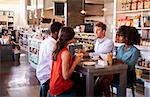 Business Group Having Informal Meeting In Cafe