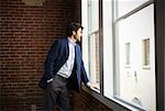 Businessman Standing By Office Window