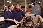 Engineer Training Female Apprentice On Milling Machine