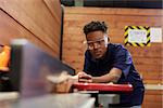 Carpenter Using Plane In Woodworking Woodshop