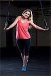 Portrait Of Young Woman In Gym With Olympic Rings