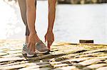 Man stretching on pier