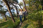 Young couple strolling in coastal forest, Split, Dalmatia, Croatia