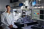 Portrait of scientist in laboratory looking at camera smiling