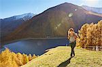 Woman hiking, looking at view, Schnalstal, South Tyrol, Italy