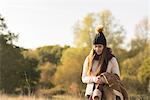 Young woman walking in rural setting