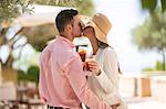 Couple sharing a kiss on arrival to boutique hotel, Majorca, Spain